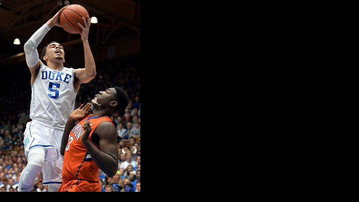 
Duke guard Tyus Jones goes up against Clemson’s Josh Smith during the Blue Devils win last Saturday in Durham. Jahlil Okafor did not play in the game. 
