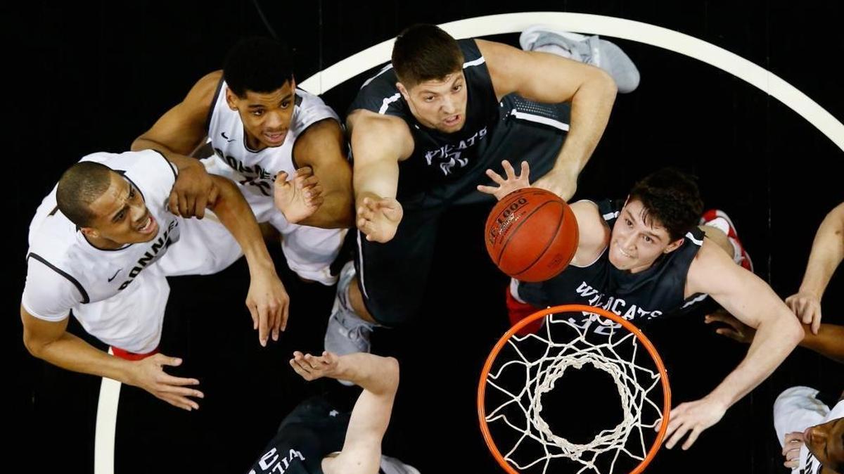 Davidson guard Rusty Reigel, right, battles for the ball along with Wildcats teammates Peyton Aldridge, lower left, and Andrew McAuliffe against the St. Bonaventure Bonnies during Friday’s quarterfinals game in the Atlantic 10 basketball tournament at the Barclays Center in New York.