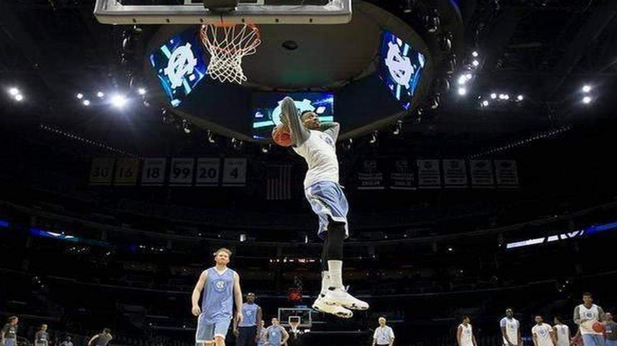 
J.P. Tokoto, seen here dunking during an NCAA tournament practice, told Yahoo! Sports that there’s more to his game than dunking and defense.
