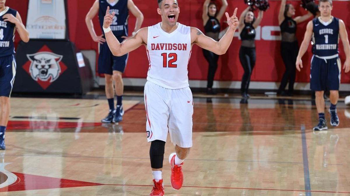 Davidson’s Jack Gibbs (12) celebrates Saturday’s 87-80 upset win over George Washington at the John M. Belk Arena. Gibbs finished with a game-high 31 points.