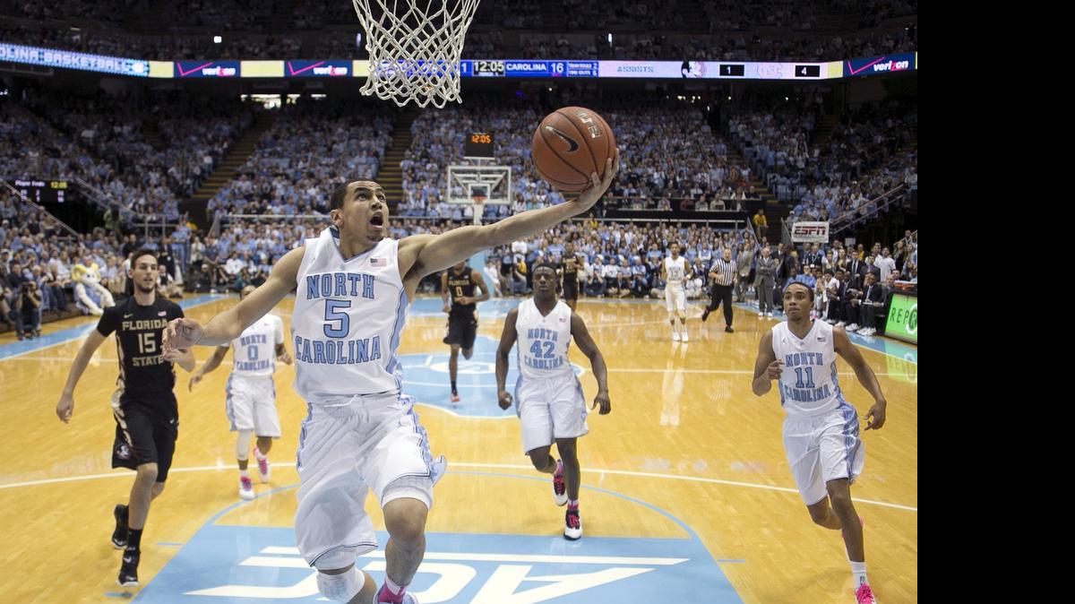 
UNC’s Marcus Paige (5) drives to the basket on a fast break against  Florida State on January 24, 2015 at the Smith Center in Chapel Hill.
