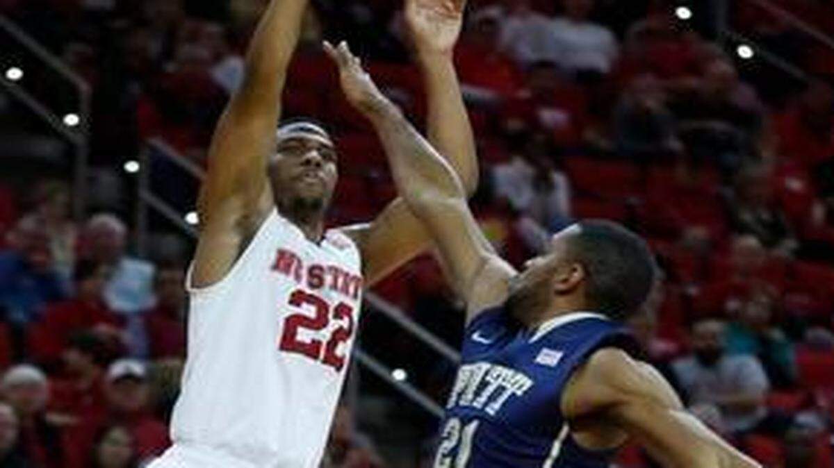 
N.C. State’s Ralston Turner drills a 3-pointer as Pitt’s Sheldon Jeter defends Jan. 3 at PNC Arena. N.C. State won 68-50.
