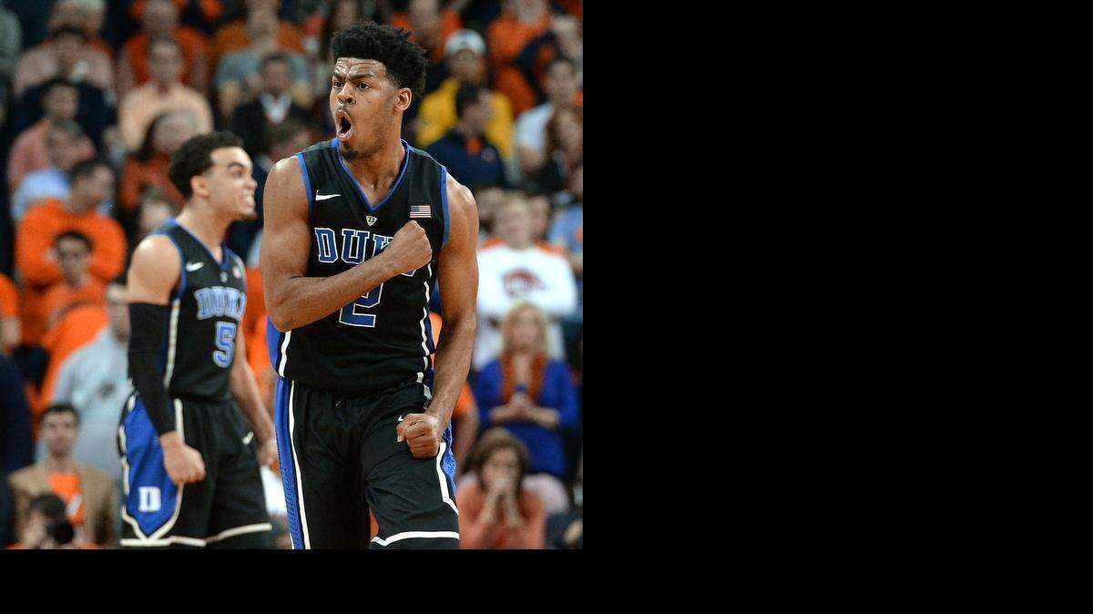
Duke guard Quinn Cook reacts as time runs out on the Cavaliers as Duke upset undefeated Virginia 69-63 on Jan. 31 at John Paul Jones Arena at the University of Virginia in Charlottesville, Va. 
