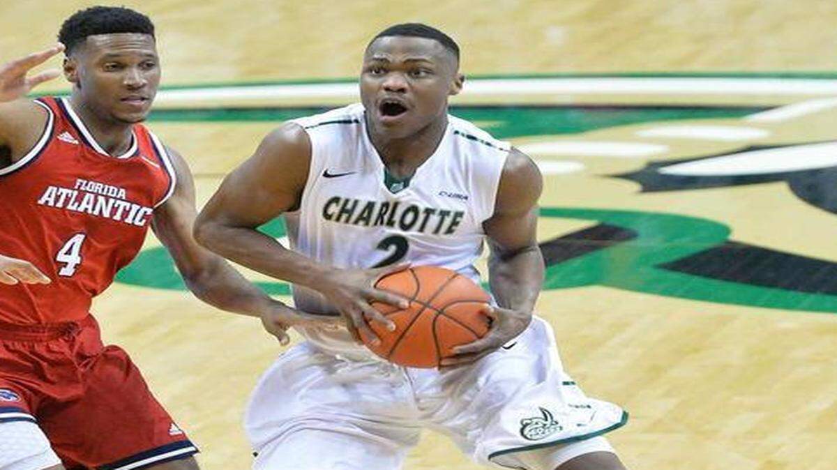 
Charlotte 49ers Torin Dorn (right) drives the ball to the basket against Florida Atlantic Owls Justin Massey (left), during at UNC Charlotte's Halton Arena, Jan. 29.
