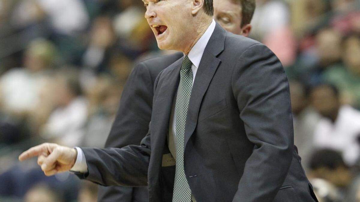 Head coach Mark Price talks to his team while facing Elon during the Charlotte 49ers home opener men's basketball game Friday, November 13, 2015 at Halton Arena.
