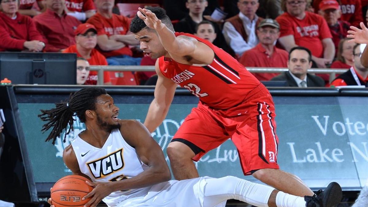 Davidson’s Jack Gibbs, right, tries to steal the ball from VCU’s Doug Brooks during first-half action Friday at John M. Belk Arena.