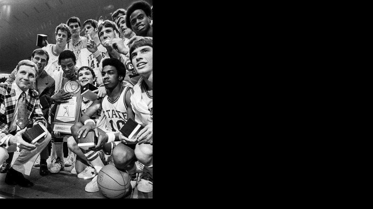 
The 1974 NC State Wolfpack poses with the National Championship trophy after defeating Marquette for the title.
