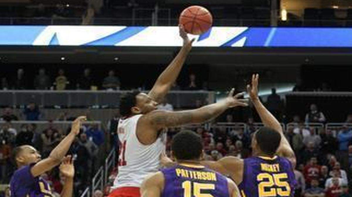 
N.C. State's BeeJay Anya makes the winning shot to give the Wolfpack a 66-65 victory over LSU in the second round of the NCAA Division I Men's Basketball Tournament at the Consol Energy Center in Pittsburgh.
