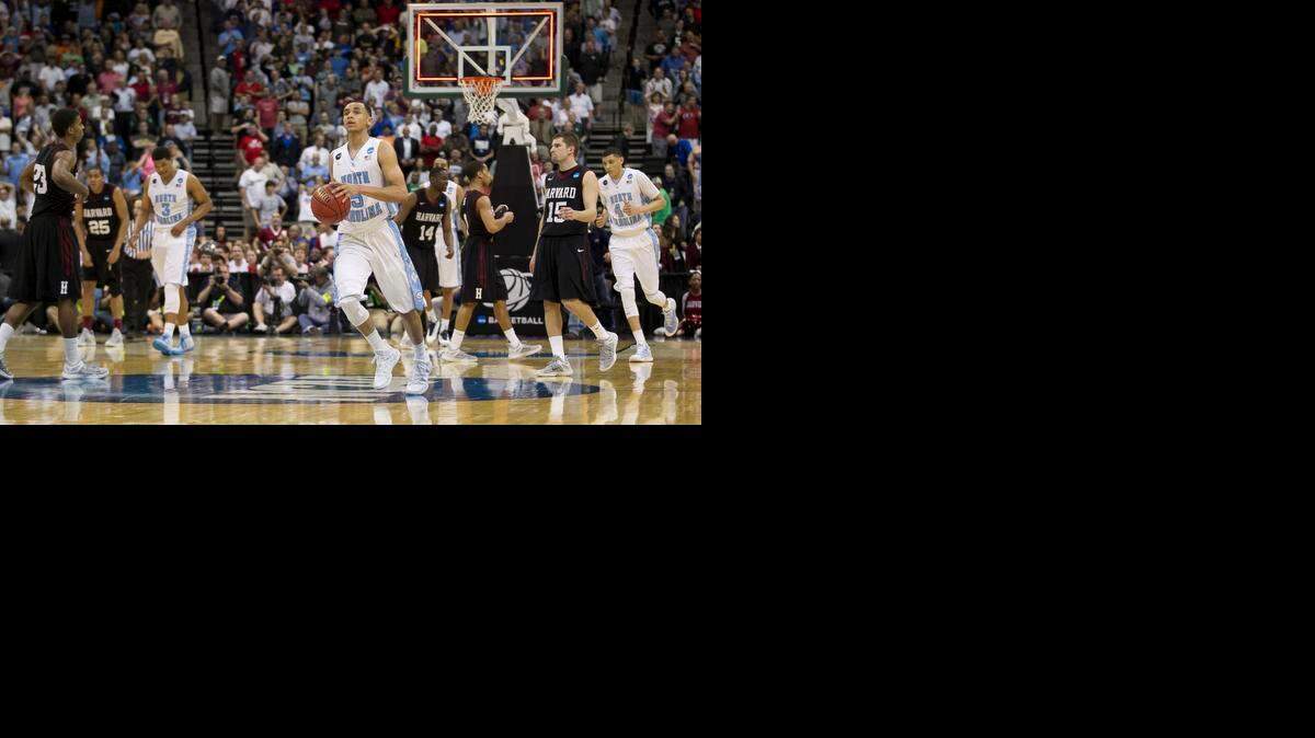 
North Carolina guard Marcus Paige (5) dribbles the ball as time expires and North Carolina escapes with a 67-65 victory over Harvard in the NCAA Tournament on Thursday, March 19, 2015 at the Jacksonville Veterans Memorial Arena in Jacksonville, Fla.
