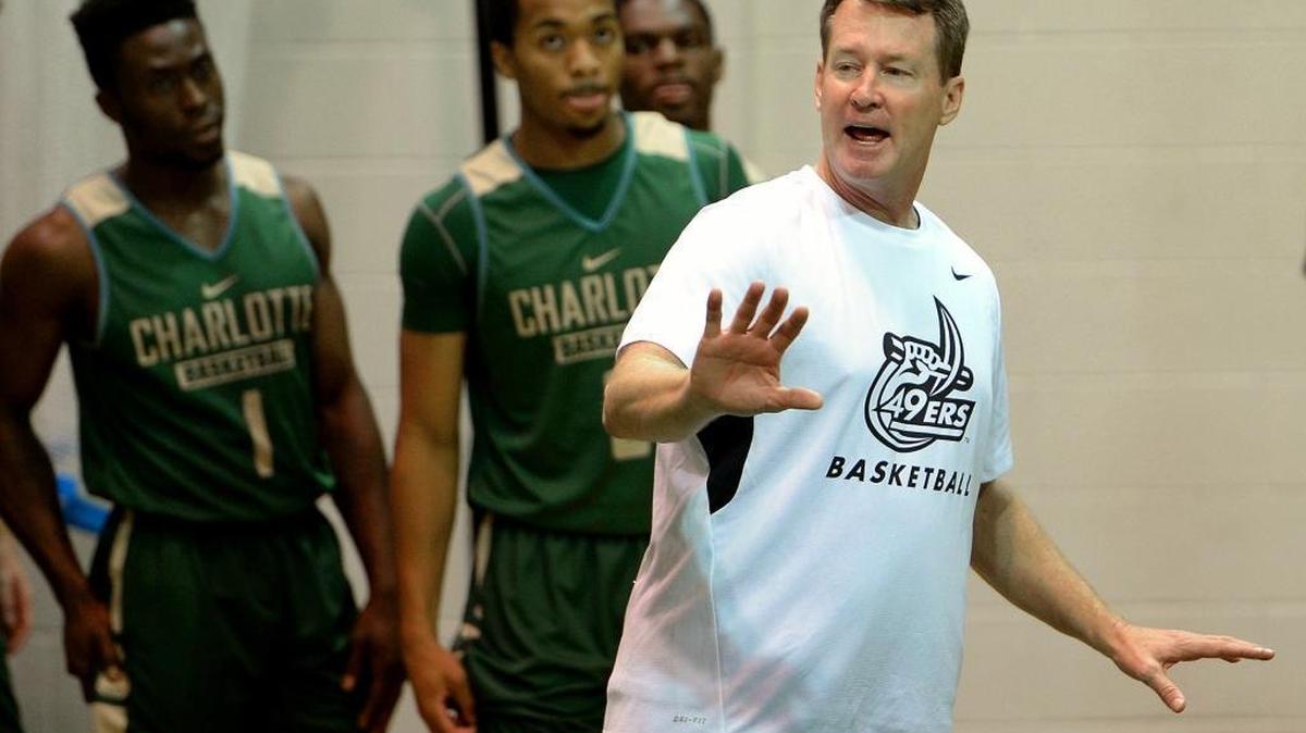
Charlotte 49ers men’s basketball coach Mark Price (right) during his first practice with the team on Friday.
