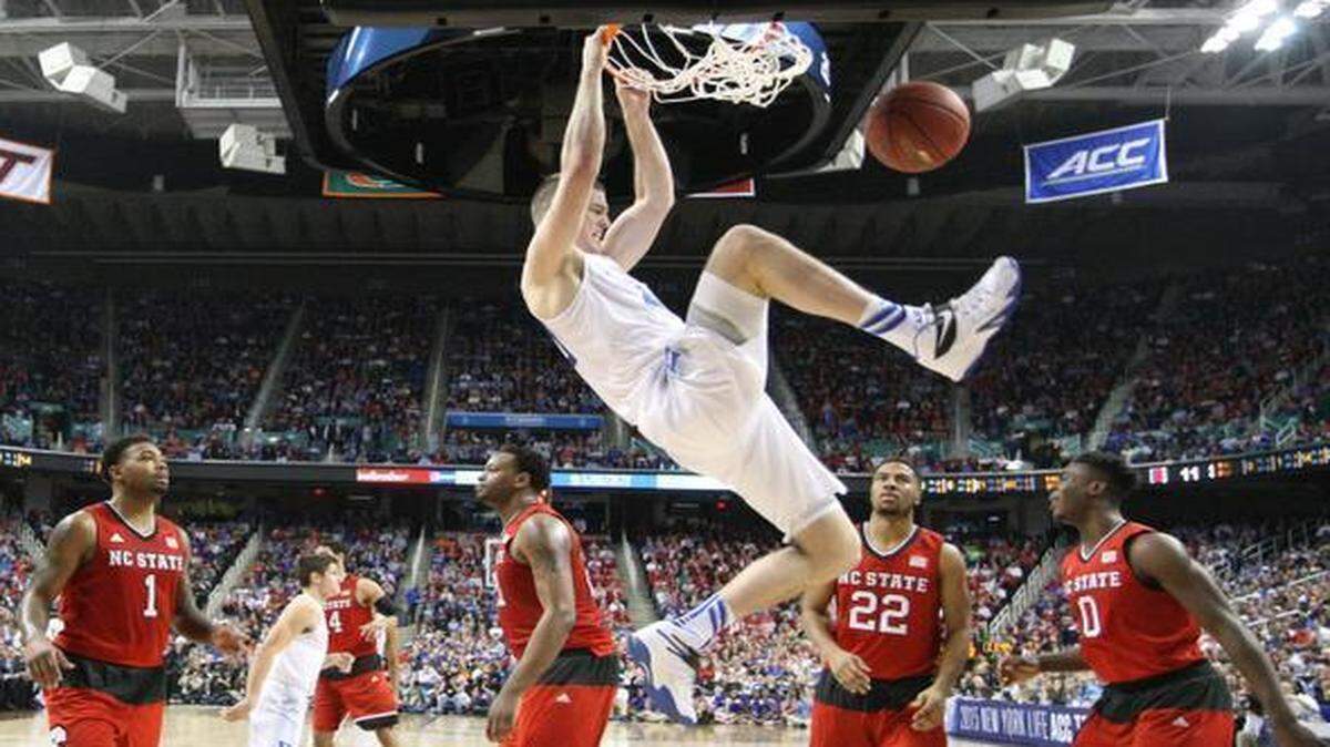 
Duke's Marshall Plumlee slams in two in the first half of the Blue Devils’ 77-53 victory over the Wolfpack in the quarterfinals of the 2015 ACC Tournament at the Greensboro Coliseum.
