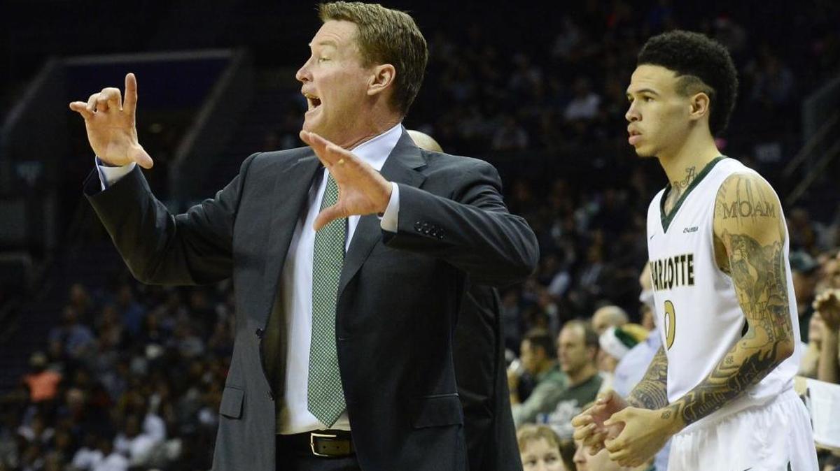 Coach Mark Price, left, and the Charlotte 49ers’ basketball team will play Maryland next season in Baltimore.