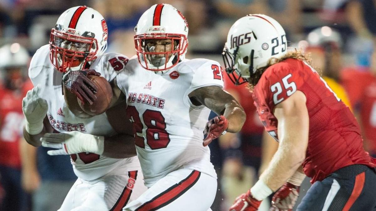 
N.C. State’s Jaylen Samuels (28) looks to maneuver by South Alabama linebacker Blake Dees (25). 
