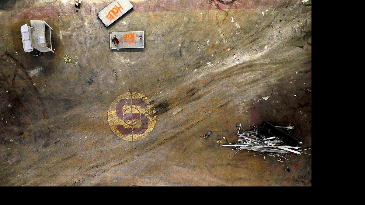 
The Block S, from the original Tartan floor, that was the court from 1975 to 1991, has been exposed as work continues on Reynolds Coliseum on the campus of N.C. State Friday, June 12, 2015. The Tartan floor will be covered when construction is complete. Construction on the $35 million project started in March. It is expected to be complete by August 2016.
