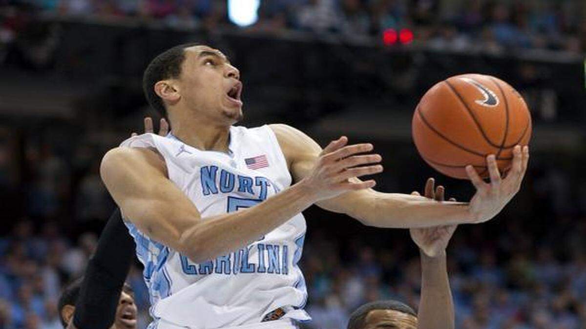 
UNC's Marcus Paige (5) drives to the basket past Florida State's Devon Bookert (1) on Saturday, January 24, 2015 at the Smith Center in Chapel Hill.
