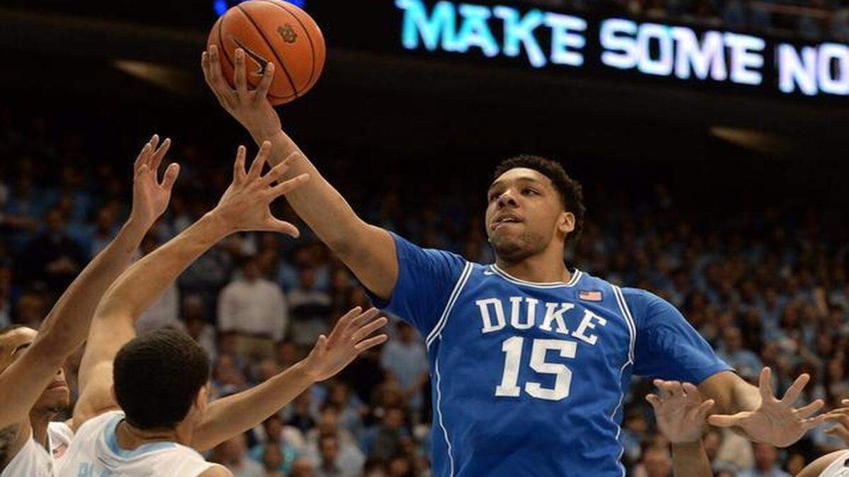 
Duke center Jahlil Okafor (15) goes in for two points in the first half as UNC guard Marcus Paige (5) defends. Duke and UNC battled at the Dean Smith Center in Chapel Hill, Saturday, March 7, 2015 in the final game of the regular season.
