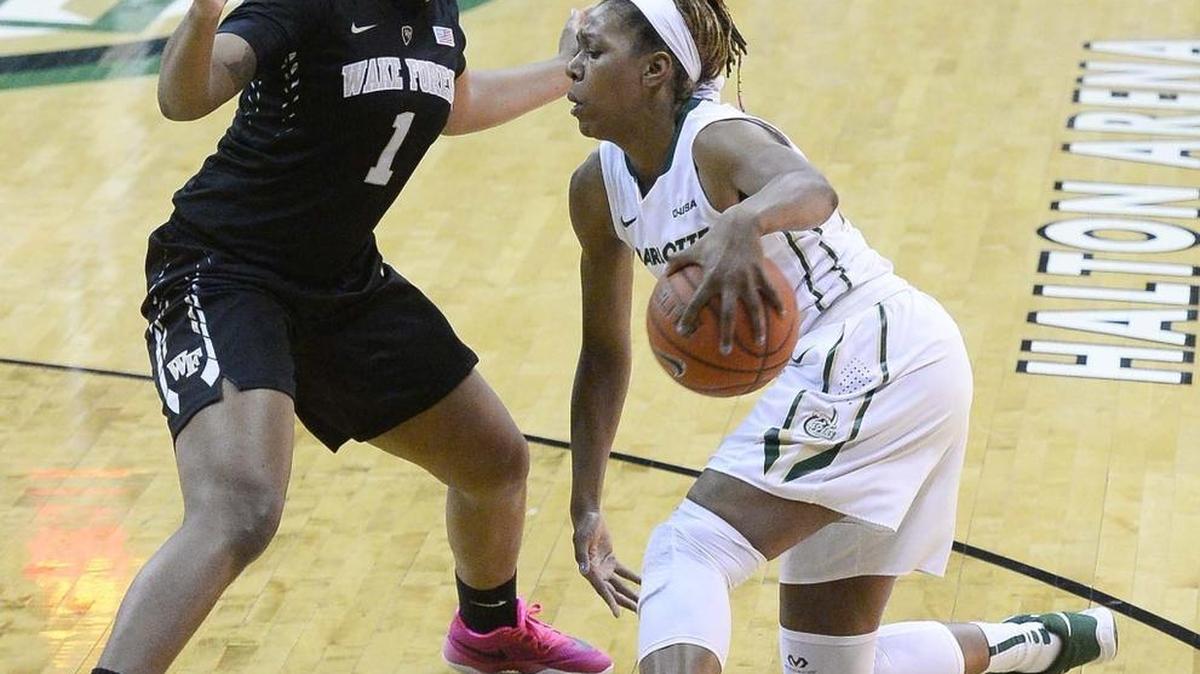 Charlotte 49ers forward Kira Gordon, right, drives the ball against Wake Forest’s Destini Walker during Thursday night's Women's NIT game at UNC Charlotte Halton Arena.