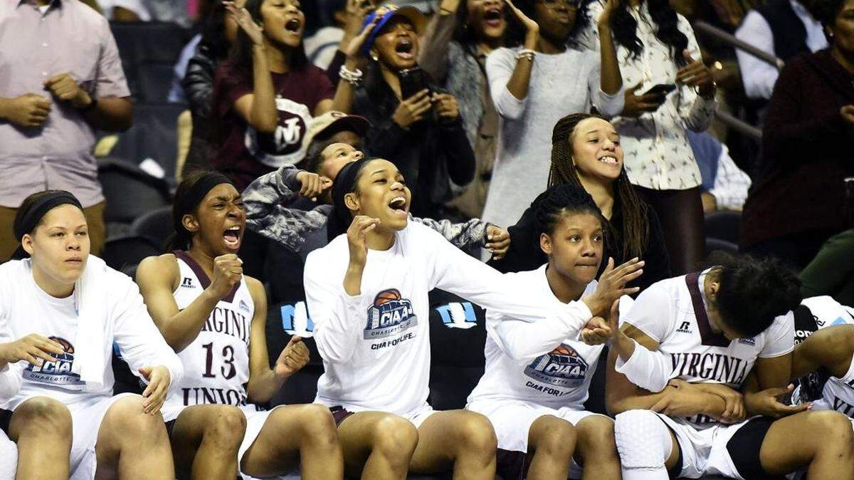 The Virginia Union bench and fans erupt as their team pulls away for the lead to defeat shaw University 70-66 in the CIAA women's championship game on Saturday at Time Warner Cable Arena..