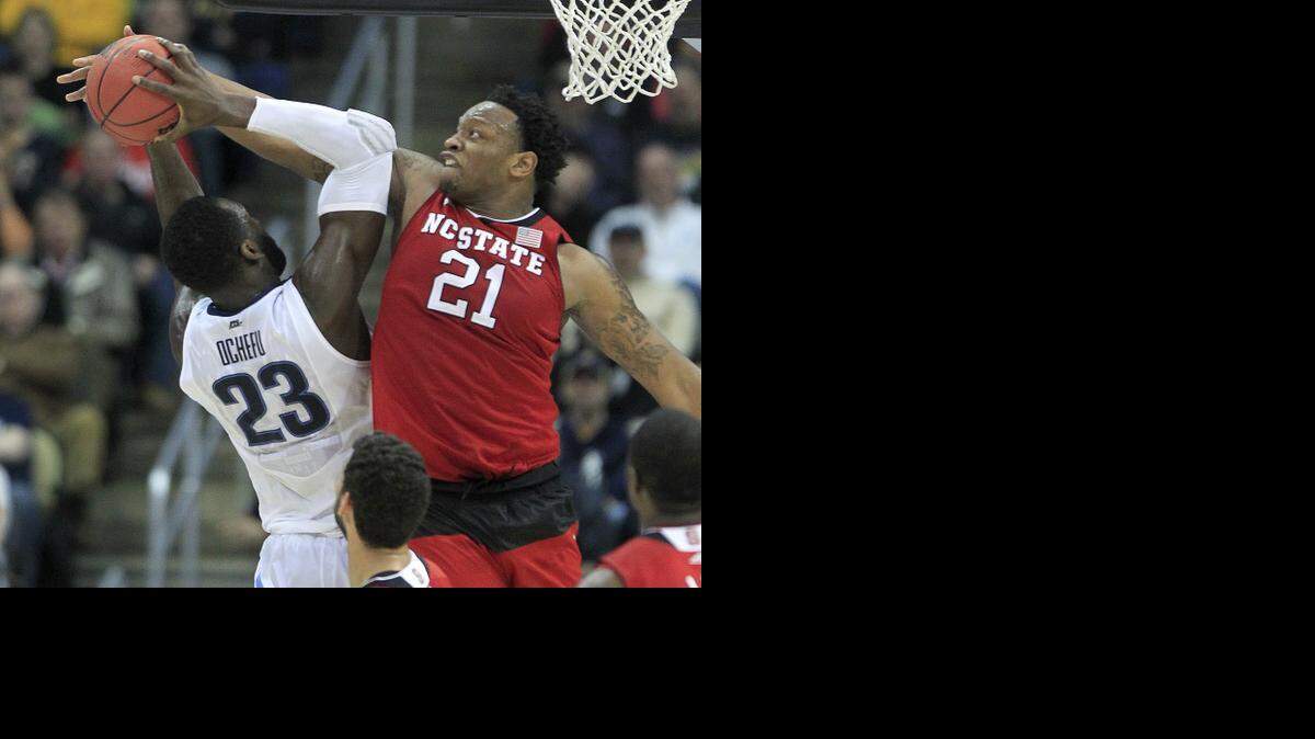 
N.C. State's BeeJay Anya (21) stops the shot by Villanova's Daniel Ochefu (23) during the first half in the third round NCAA Division I Men's Basketball Tournament at the Consol Energy Center in Pittsburgh.
