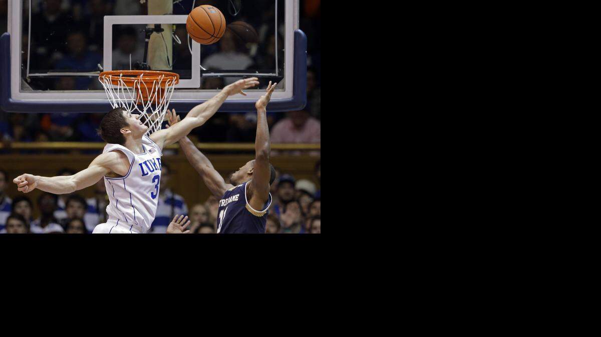 
Duke's Grayson Allen (3) blocks a shot by Notre Dame's Demetrius Jackson during the second half of an NCAA college basketball game in Durham, N.C., Saturday, Feb. 7, 2015. Duke won 90-60. 
