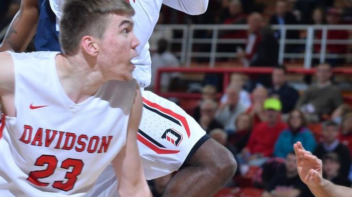 Davidson’s Jordan Watkins (with ball) scored 14 points in a victory Wednesday against Duquesne.