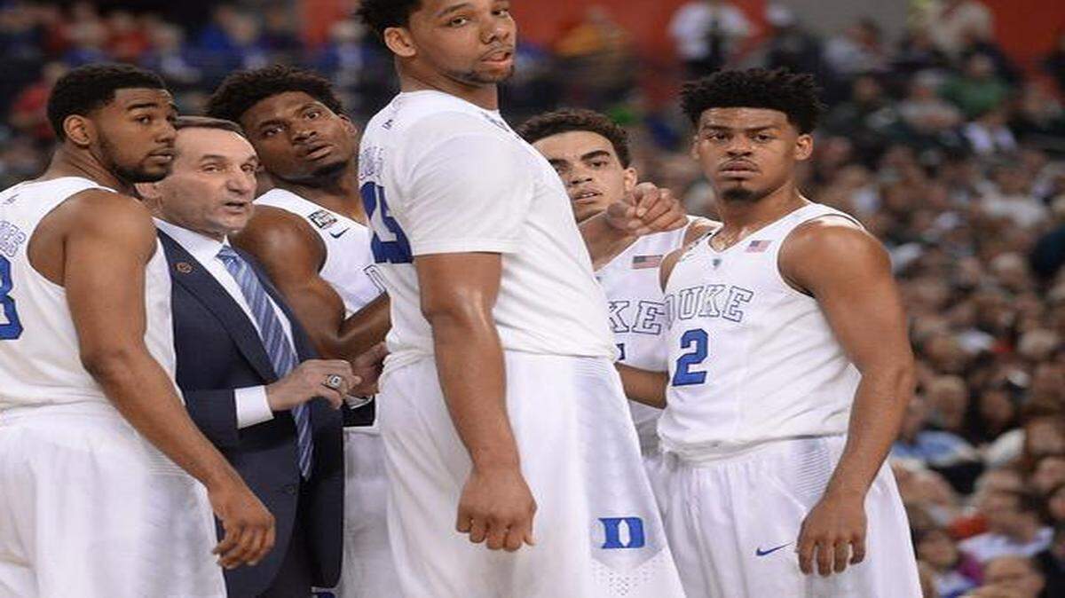
Duke coach Mike Krzyzewski speaks with his team during a second-half timeout in the game agains Michigan State. From left:Matt Jones (13), Krzyzewski, Justise Winslow, Jahlil Okafor, Tyus Jones and Quinn Cook. 

