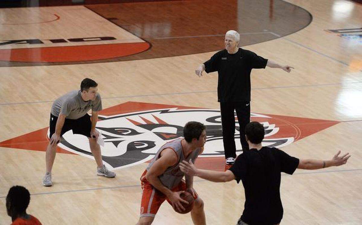 Observer file photo: Matt McKillop, left, is pictured coaching alongside his father, Bob McKillop, right, early in his tenure as an assistant.