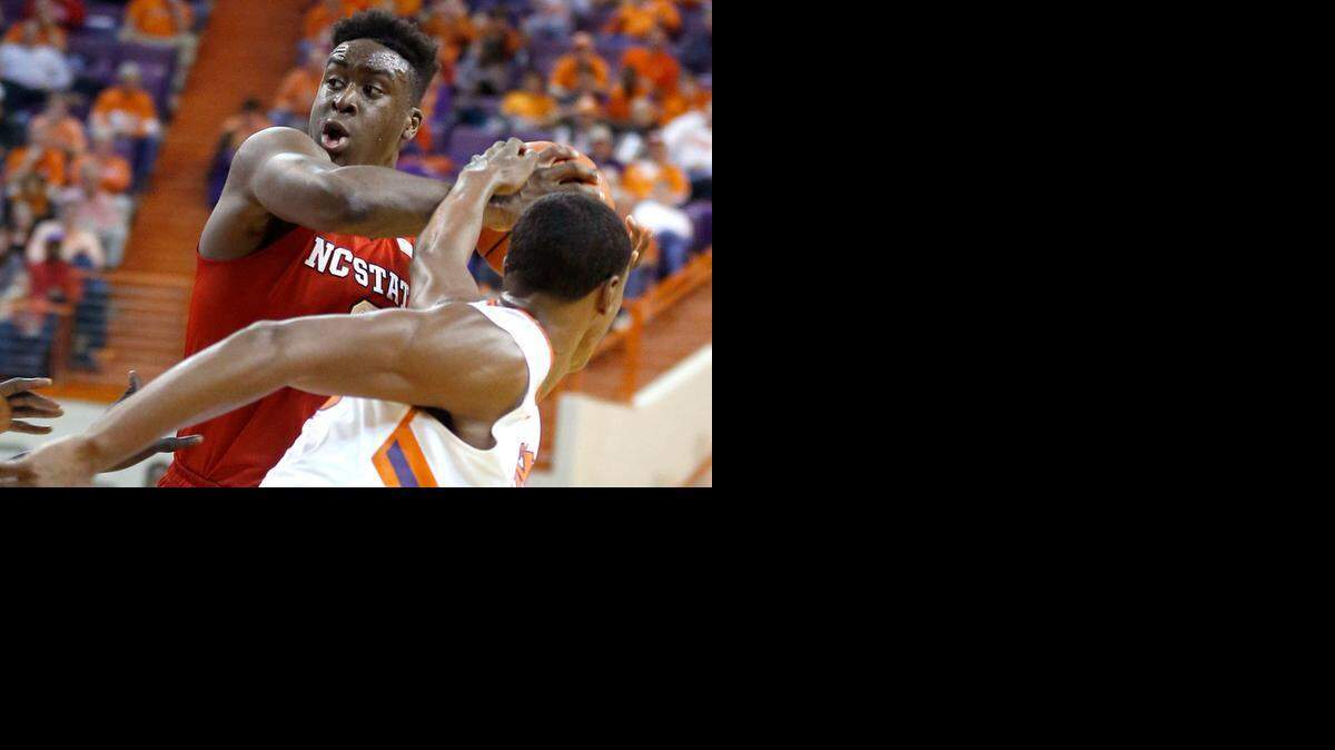 
N.C. State's Abdul-Malik Abu, left, keeps a rebound from Clemson's Donte Grantham during N.C. State's 66-61 victory over Clemson at Littlejohn Coliseum in Clemson, S.C., Tuesday, March 3, 2015.
