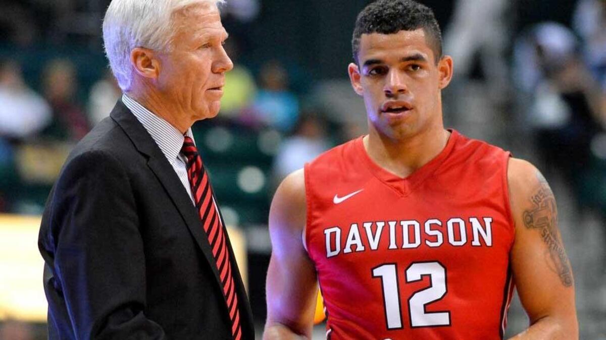 Junior Jack Gibbs, right, reached the 30-point mark for the eighth time this season in Davidson’s 60-59 loss at George Mason. The Wildcats “fought valiantly and I’m very proud of them,” Davidson coach Bob McKillop, right, said after Saturday’s game.