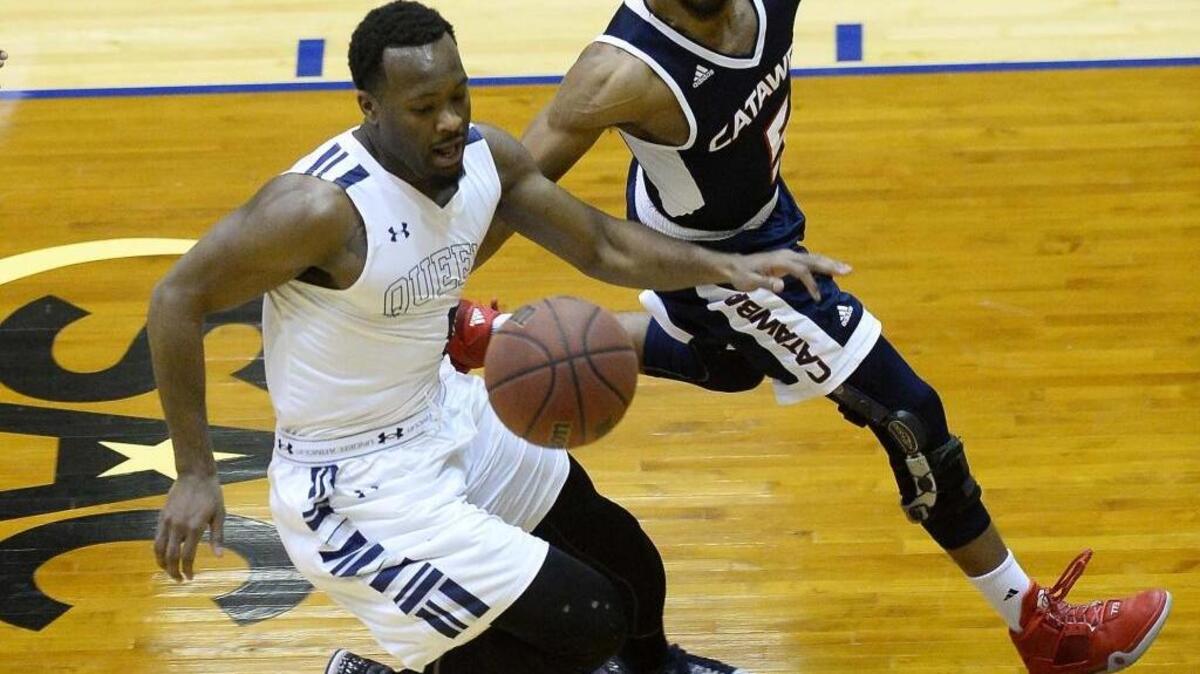 From left, Queens University's guard RJ Robinson chases after a loose ball with Catawba College's Rakeen Brown during the quarterfinals of the South Atlantic Conference men's basketball tournament at Queen's University’s Levine Center March 2, 2016.