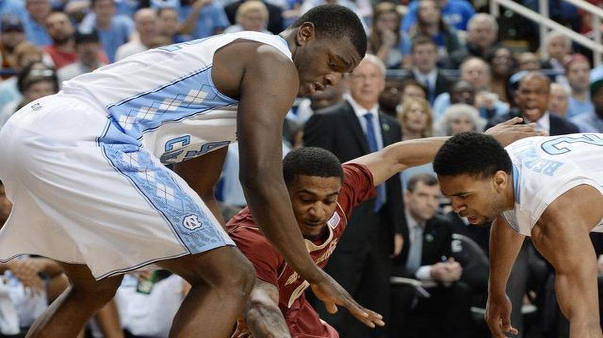 
Boston College’s Garland Owens (0) dives for a loose ball as North Carolina’s Joel James (42) and Joel Berry II (2) try and steal it during the first half in the second round of the Atlantic Coast Conference basketball tournament in Greensboro,5.
