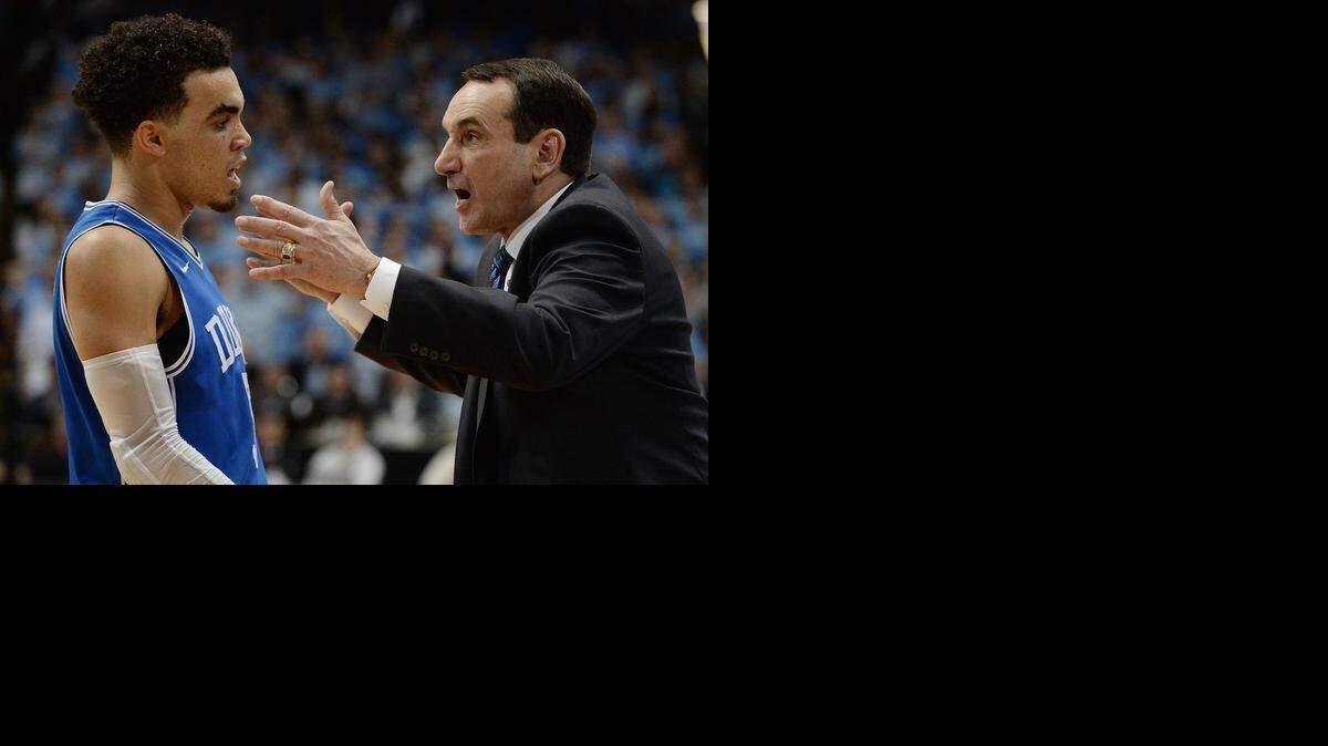 
Duke guard Tyus Jones and coach Mike Krzyzewski talk during the second half against UNC at the Dean Smith Center in Chapel Hill.
