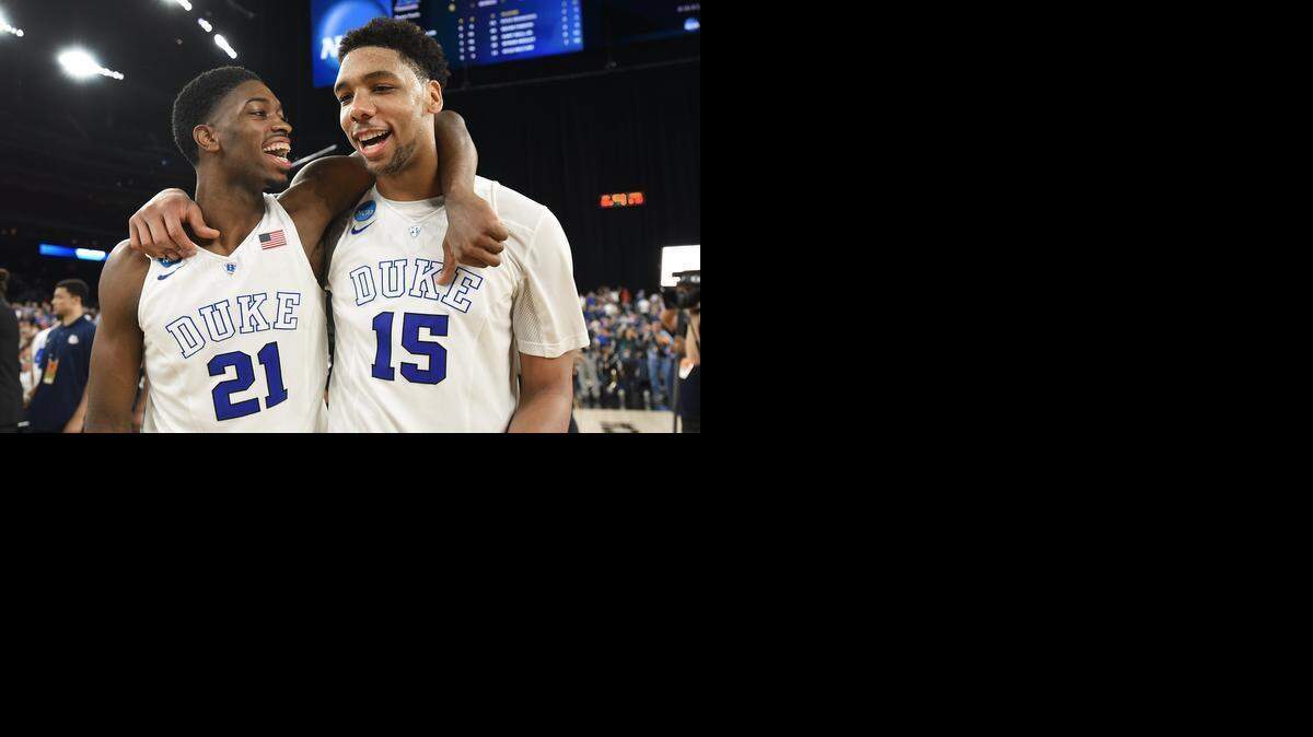 
Duke’s Amile Jefferson (21) and Jahlil Okafor are all smiles as they walk off the court after the Blue Devils beat Gonzaga 66-52 for the NCAA South Region championship and a berth in the Final Four.
