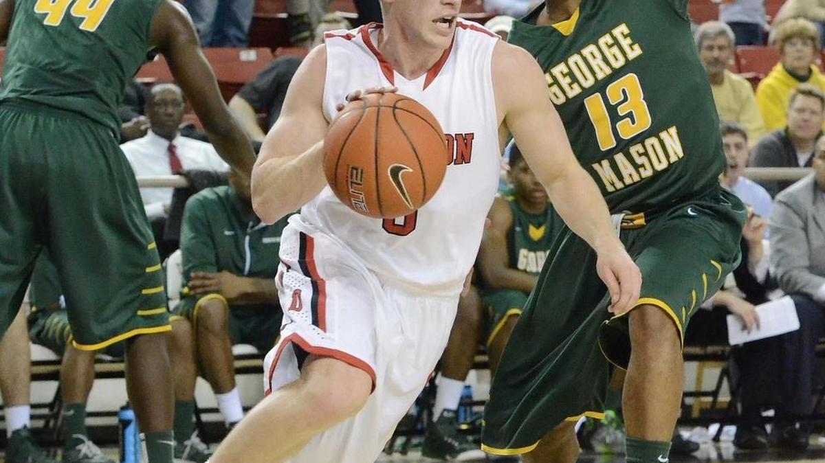Davidson’s Brian Sullivan (white uniform) missed the first game of his Davidson career last week with concussion symptoms.