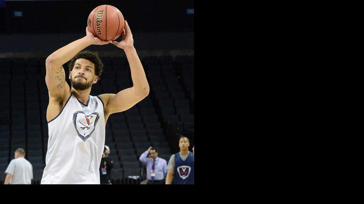 
Virginia forward Anthony Gill, a former Charlotte Christian star who is returning home for the NCAA tournament, works out during the shootaround at Time Warner Cable Arena on Thursday.
