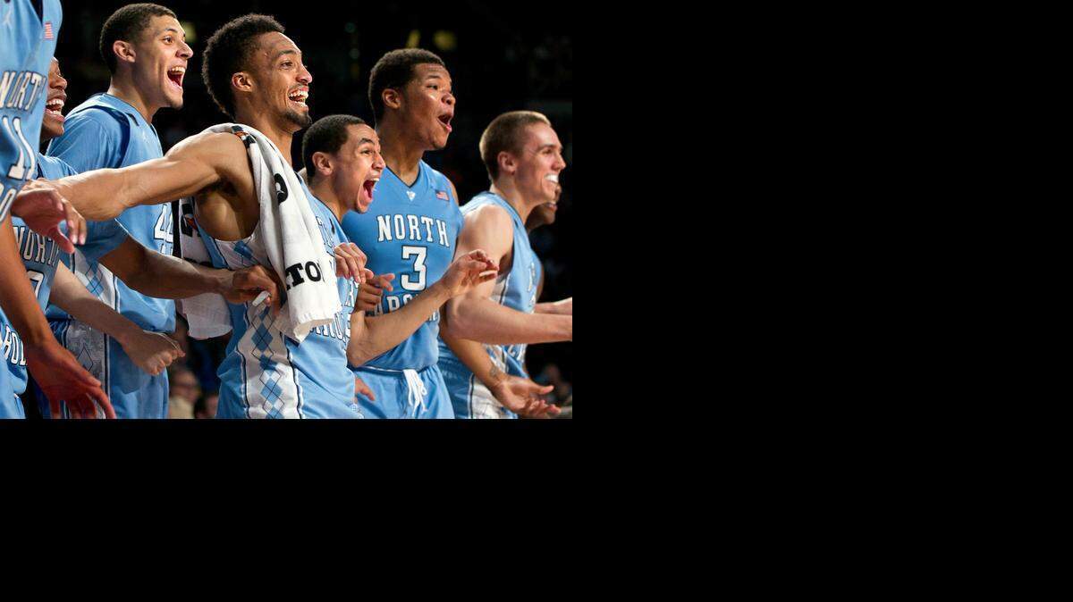 
North Carolina players, from left, Nate Britt, Justin Jackson, J.P. Tokoto, Marcus Paige, Kennedy Meeks and Jackson Simmons enjoy the late stages of Tuesday night’s rout at Georgia Tech. The Tar Heels improved to 21-9.
