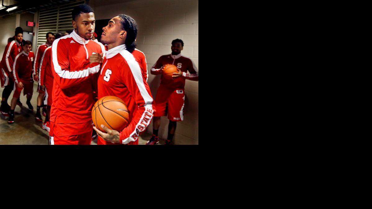 
Cat Barber, right, is encouraged by Ralston Turner before N.C. State’s game at Virginia on Jan. 7. The Wolfpack lost 61-51, and Barber had just six points, the start of a rough stretch both on and off the court for the point guard.
