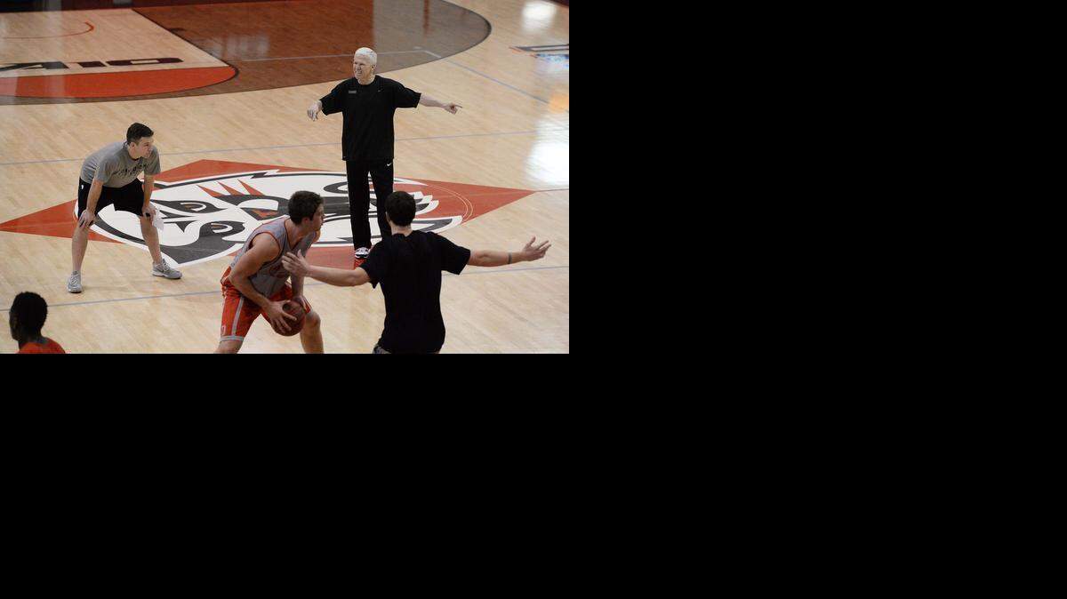 
Matt McKillop, left, often acts as a buffer between the players and his dad, head coach Bob McKillop, right.
