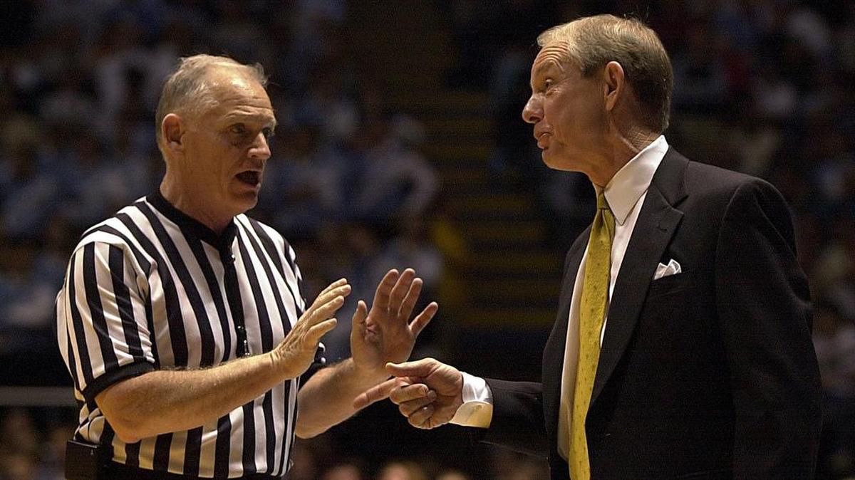 
Wake Forest coach Dave Odom questions official John Clougherty during a January 2001 game against UNC. Clougherty, who plans to retire after the 2015-16 basketball season, will be inducted into the North Carolina Sports Hall of Fame on May 15.
