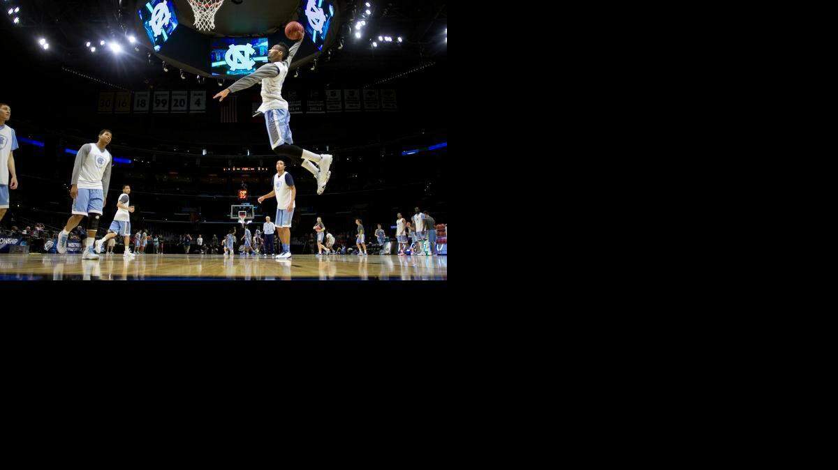 
North Carolina’s J.P. Tokoto dunks during the Tar Heels’ practice  Wednesday in Los Angeles. Tokoto and the Tar Heels’ frontline will face Wisconsin center Frank Kaminsky, who leads the Badgers in scoring (18.4 points), rebounding (8.1) and field-goal percentage (.556). 



