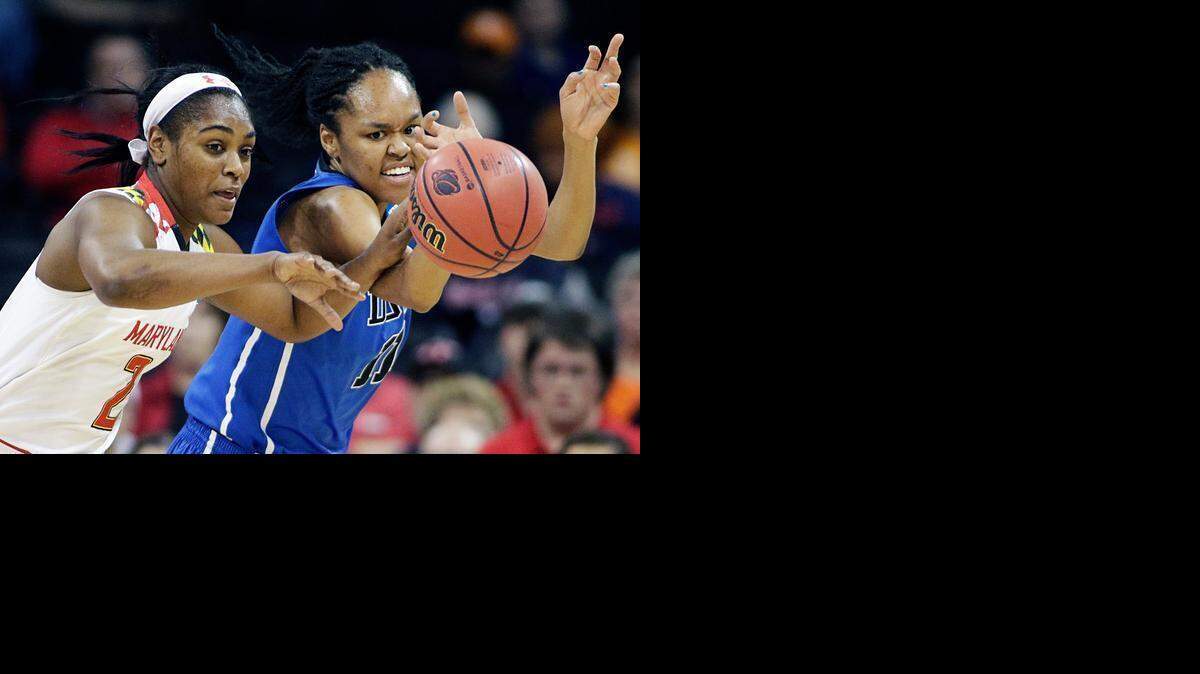 
Maryland's Kiara Leslie (2) and Duke's Azura Stevens (11) chase a loose ball during the first half of a women's college basketball regional semifinal game in the NCAA tournament, Saturday, March 28, 2015, in Spokane, Wash. (AP Photo/Young Kwak)
