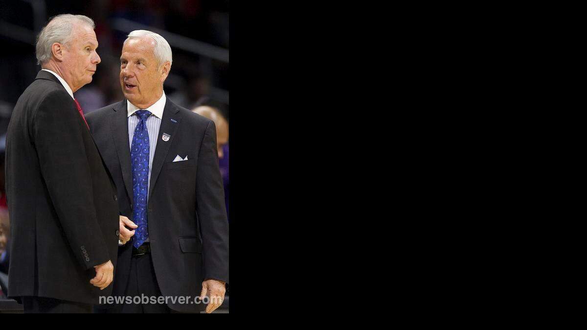 
North Carolina coach Roy Williams talks with Wisconsin coach Bo Ryan prior to their game on Thursday, March 26, 2015 at the Staples Center in Los Angeles, California.

