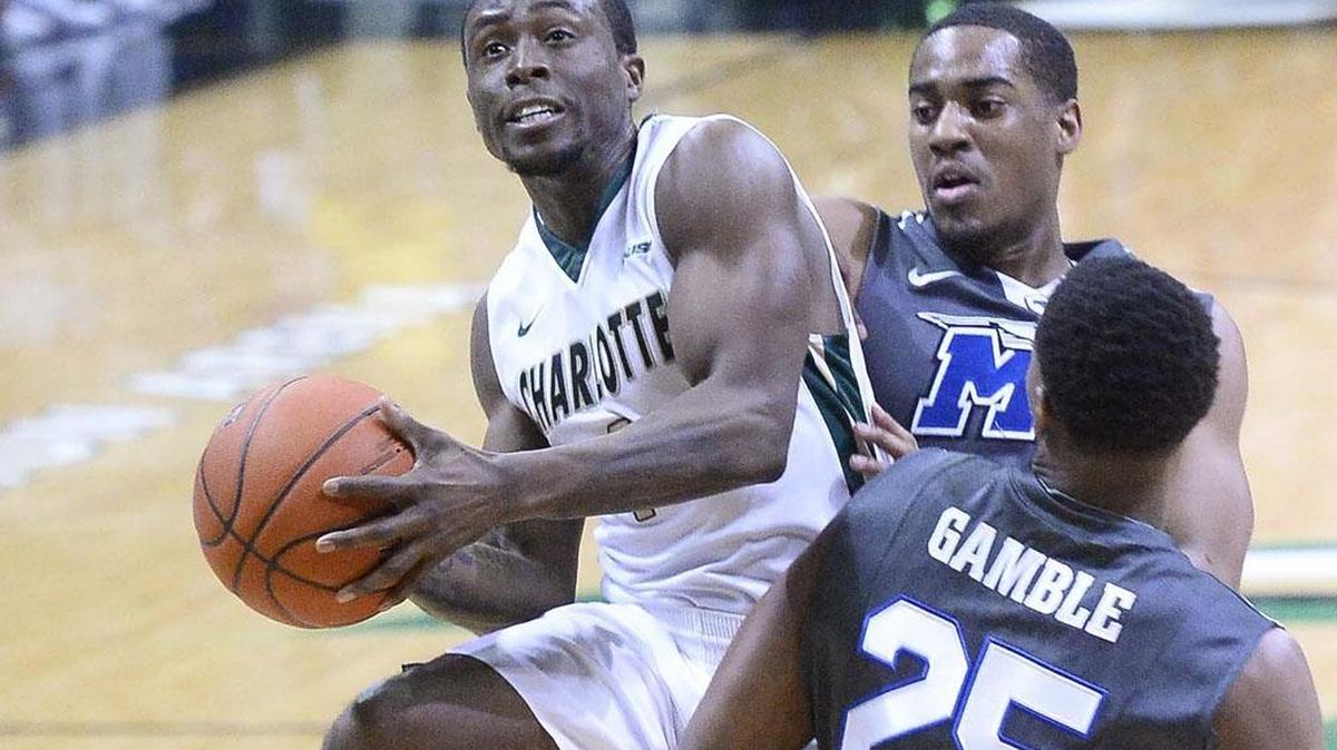 Charlotte 49ers guard Braxton Ogbueze on left, drives the ball to the basket against Middle Tennessee's Karl Gamble in a Jan. 14 game at Halton Arena.