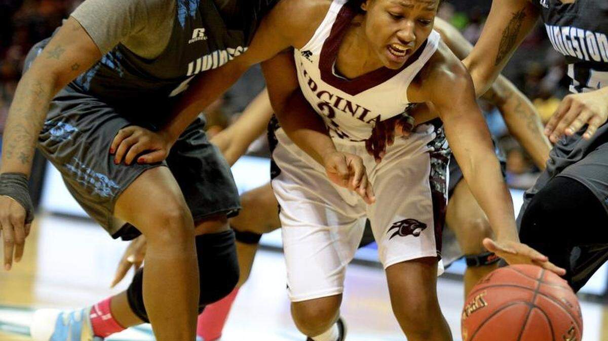Livingstone #43 Alexis Fowler, Virginia Union #3 Kiana Johnson and Livingstone #14 Kyala Searcy, far right, fight for a loose ball during the Livingstone vs. Virginia Union CIAA women's tournament semifinal at Time Warner Cable Arena. Virginia Union won 93-63.