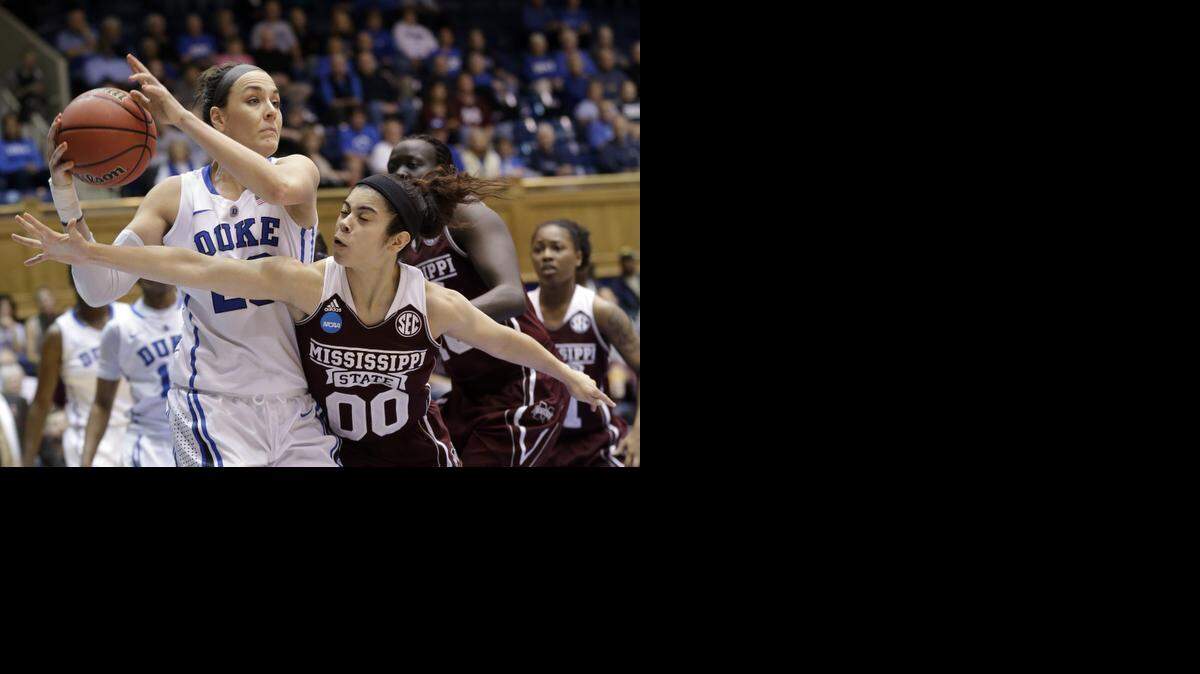
Duke’s Rebecca Greenwell controls the ball as Mississippi State’s Dominique Dillingham  defends during the first half of their NCAA tournament game  in Durham.
