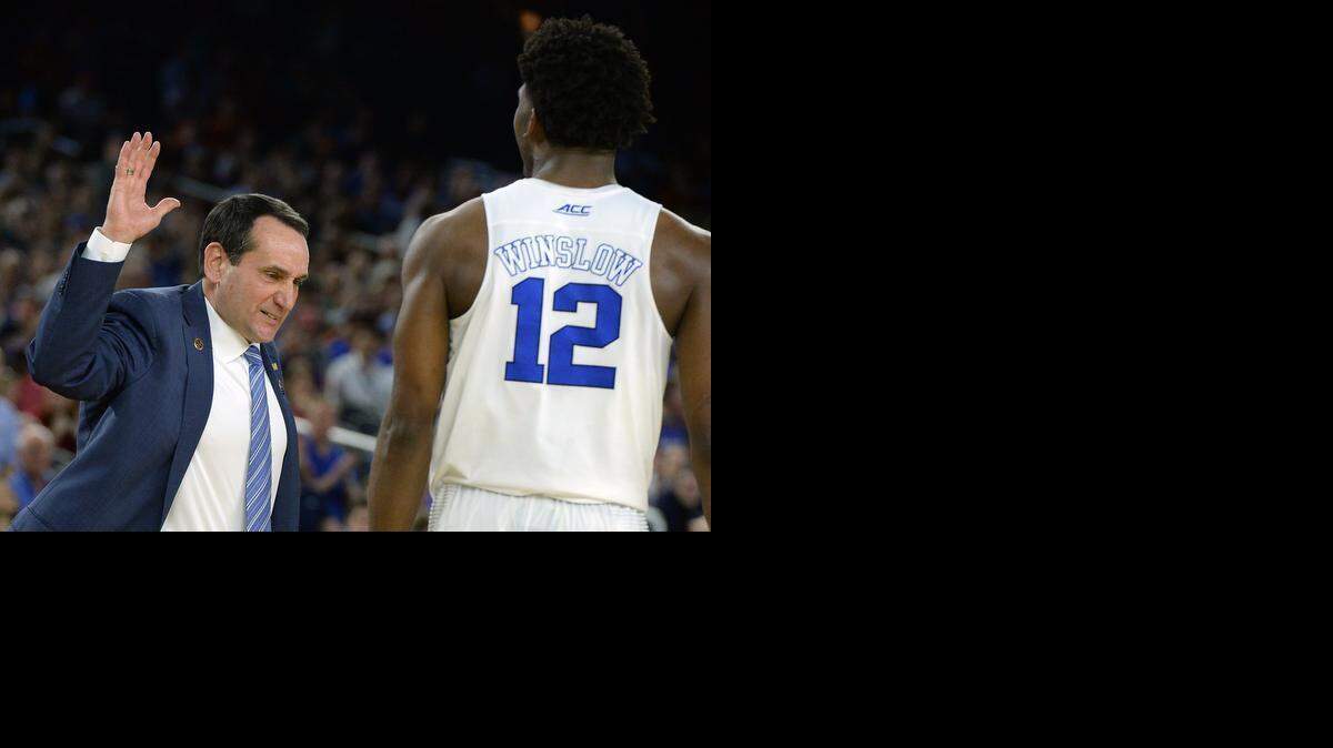 
Duke coach Mike Krzyzewski goes to slap hands with Duke forward Justise Winslow near the end of the Blue Devils’ 63-57 win over Utah in the semifinals of the NCAA South Region at the NRG Stadium in Houston . 
