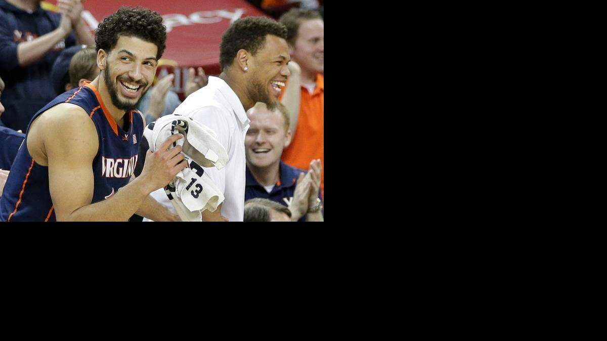 
Virginia’s Anthony Gill, left, and Justin Anderson had a lot to smile about during a 28-2 regular season. The Cavaliers are the favorites to be happy Saturday, too.


