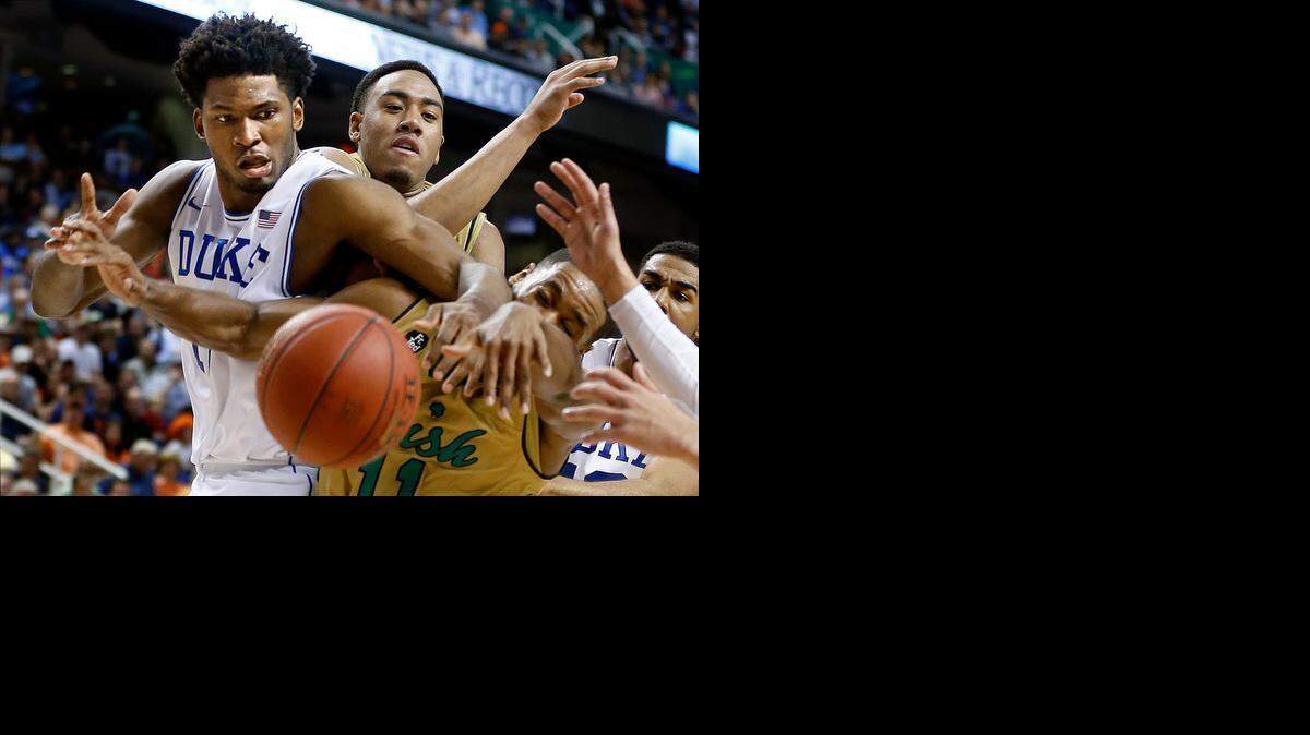 
Duke's Justise Winslow and Notre Dame's Demetrius Jackson go after the loose ball in the ACC tournament.
