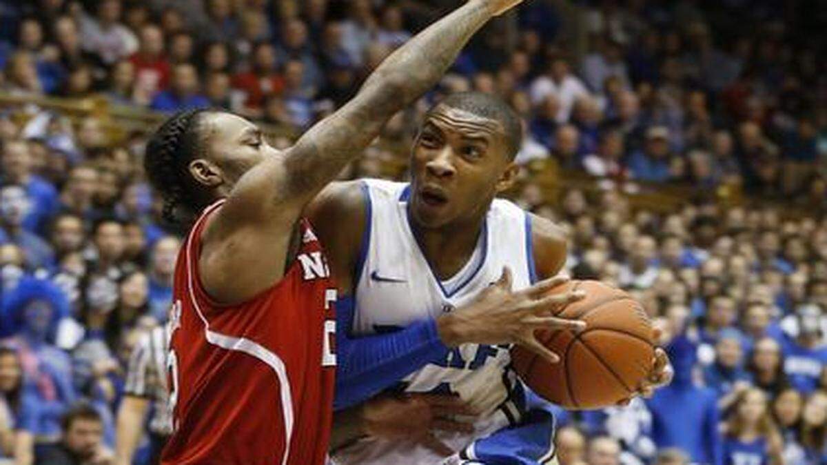 
Duke’s Rasheed Sulaimon drives against N.C. State’s Anthony “Cat” Barber at Cameron Indoor Stadium in Durham in early 2014. 
