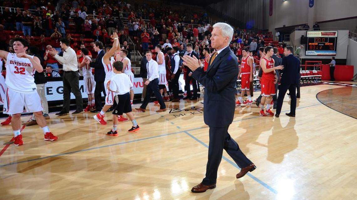 Davidson head coach Bob McKillop acknowledges the Wildcat fans who celebrate his 500th career win after non-conference basketball action against Denison at Belk Arena on Saturday. The 2008 NABC Coach of the Year, McKillop would move his career record to 500-300 as Davidson won 83-70.